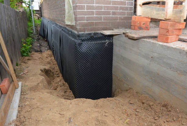 Happy homeowners after waterproofing job in King